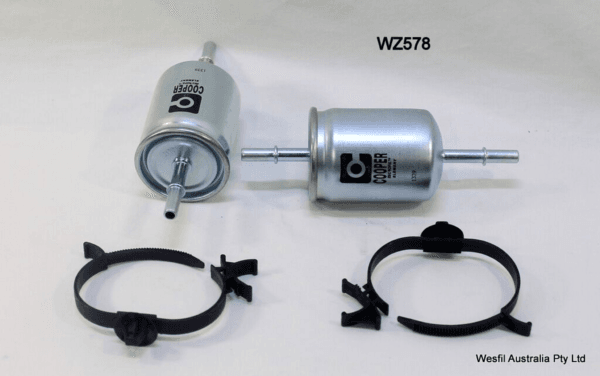 Two metal fuel filters labeled "COOPER" and "WZ2578" with two black clamps on a plain surface.