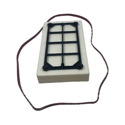 A plastic grid on top of a white rectangular foam block with a long, thin rubber band placed around it.