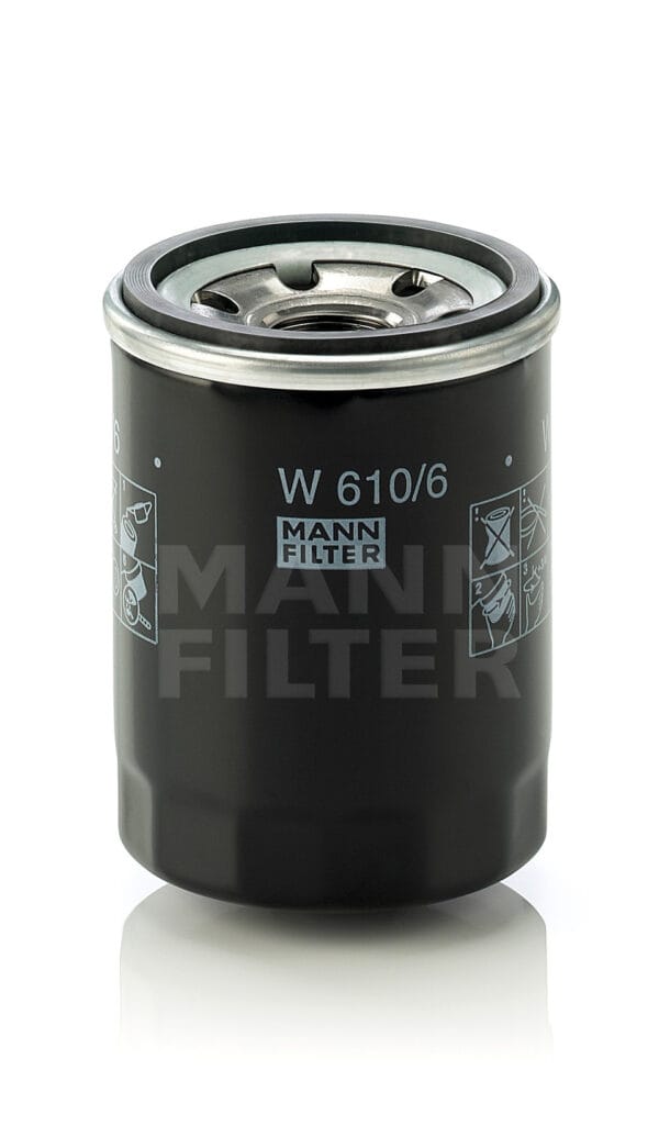 Black Mann oil filter W 610/6 standing upright on a reflective surface.