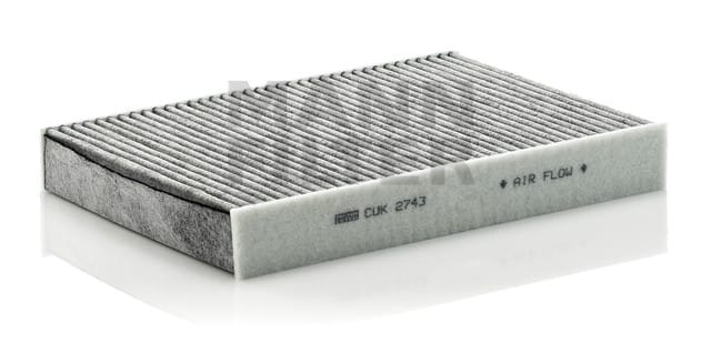 Rectangular, pleated air filter with text indicating air flow direction on the side.