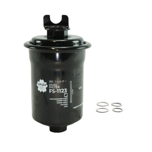 Black Sakura fuel filter model FS-1123 with three metal washers placed beside it against a white background.